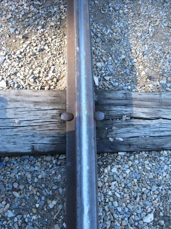 Curvature of rail head and wheel wear