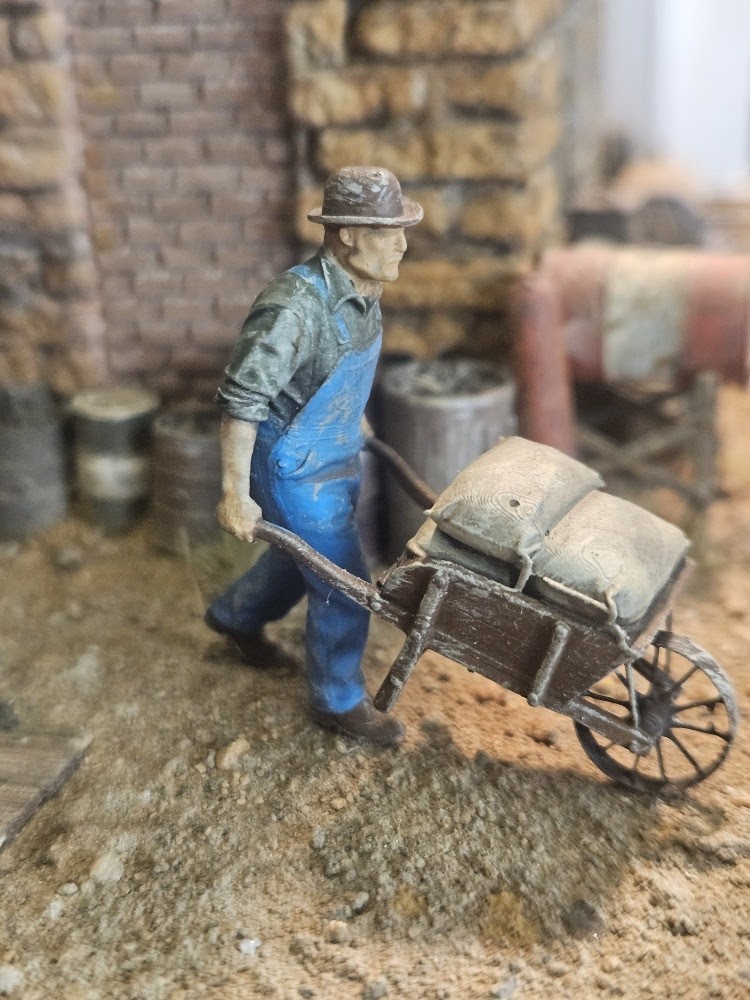 RRPR-O-20 - This is Rusty. Pushing that wheel barrel full of grain sacks